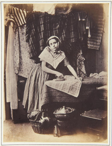 Portrait of a woman ironing