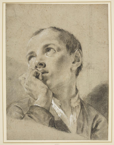 The head of a boy looking up to the left The head of a boy looking up to the left