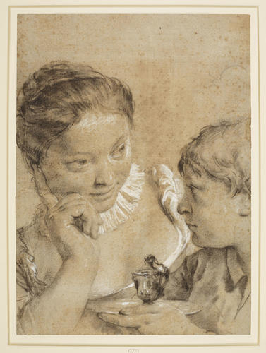 A child offering a cup to a girl