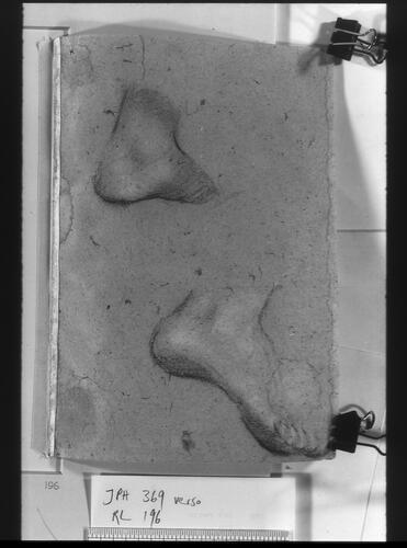 Recto: A woman's head, turned to the left. Verso: a left and a right foot Recto: A woman's head, turned to the left. Verso: a left and a right foot
