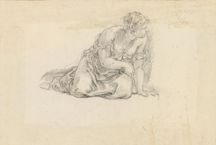A woman kneeling A woman kneeling