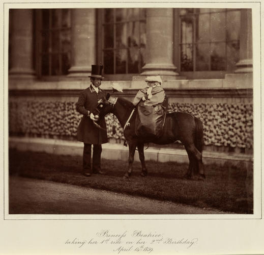 Princess Beatrice (1857-1944) taking her first ride on her second birthday