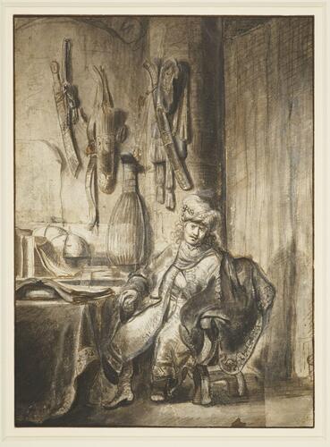 A man in a turban and elaborate robes seated in his study A man in a turban and elaborate robes seated in his study