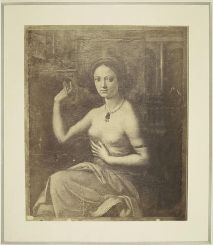 A Woman at a Mirror