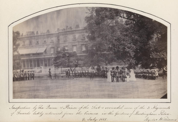 'Inspection by The Queen & Prince of the Sick & wounded men of the 3 Regiments of Guards lately returned from the Crimea in the Gardens of Buckingham Palace, 9 July 1855'