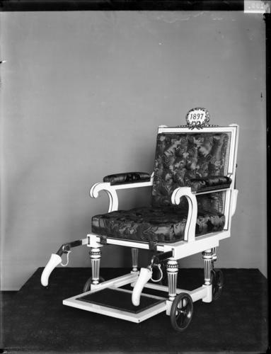 Glass plate negative of a specially designed wheelchair dated 1897 Glass plate negative of a specially designed wheelchair dated 1897