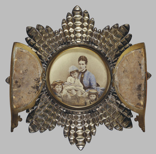 Tinted photograph of Alexandra, Princess of Wales, with her three eldest children in strut frame in the form of the Star of the Order of the Garter