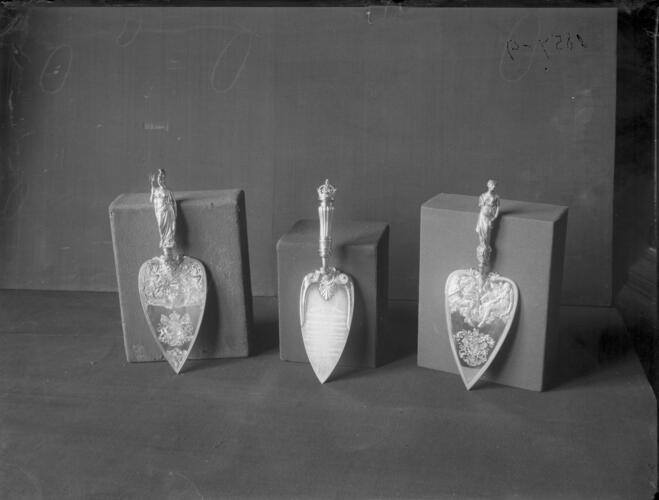 Glass plate negative of three commemorative trowels Glass plate negative of three commemorative trowels