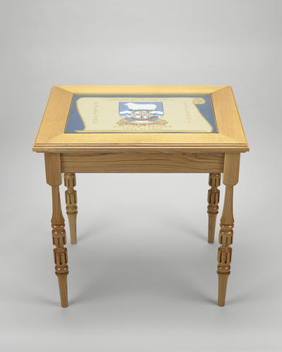 Ash wood coffee table with a glazed tapestry top
