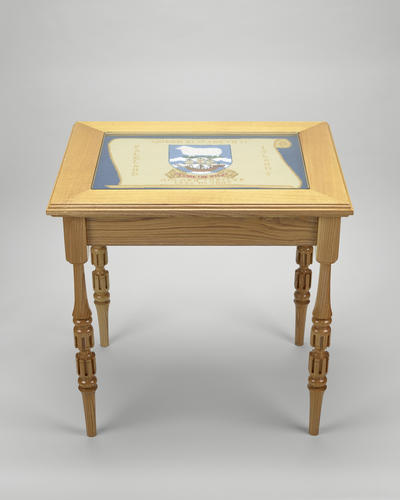 Ash wood coffee table with a glazed tapestry top Ash wood coffee table with a glazed tapestry top