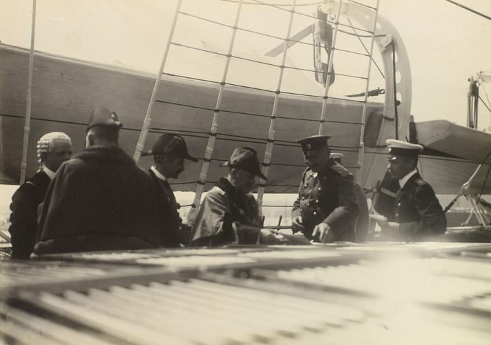 A group of men standing on the deck of the Russian Imperial Yacht Standart during the Cowes Regatta, 1909 A group of men standing on the deck of the Russian Imperial Yacht Standart during the Cowes Regatta, 1909