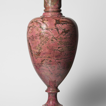 A detachable baluster shape dark pink veined marble vase and cover. From the end of the 18th century stone cutting became an important craft in the Russian city of Ekaterinburg. The vase is marked with an inscription in cyrillic which translated reads: 18